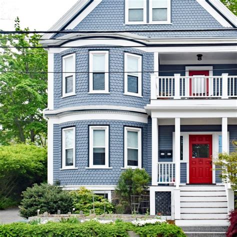 blue house with red metal roof|blue houses with red doors.